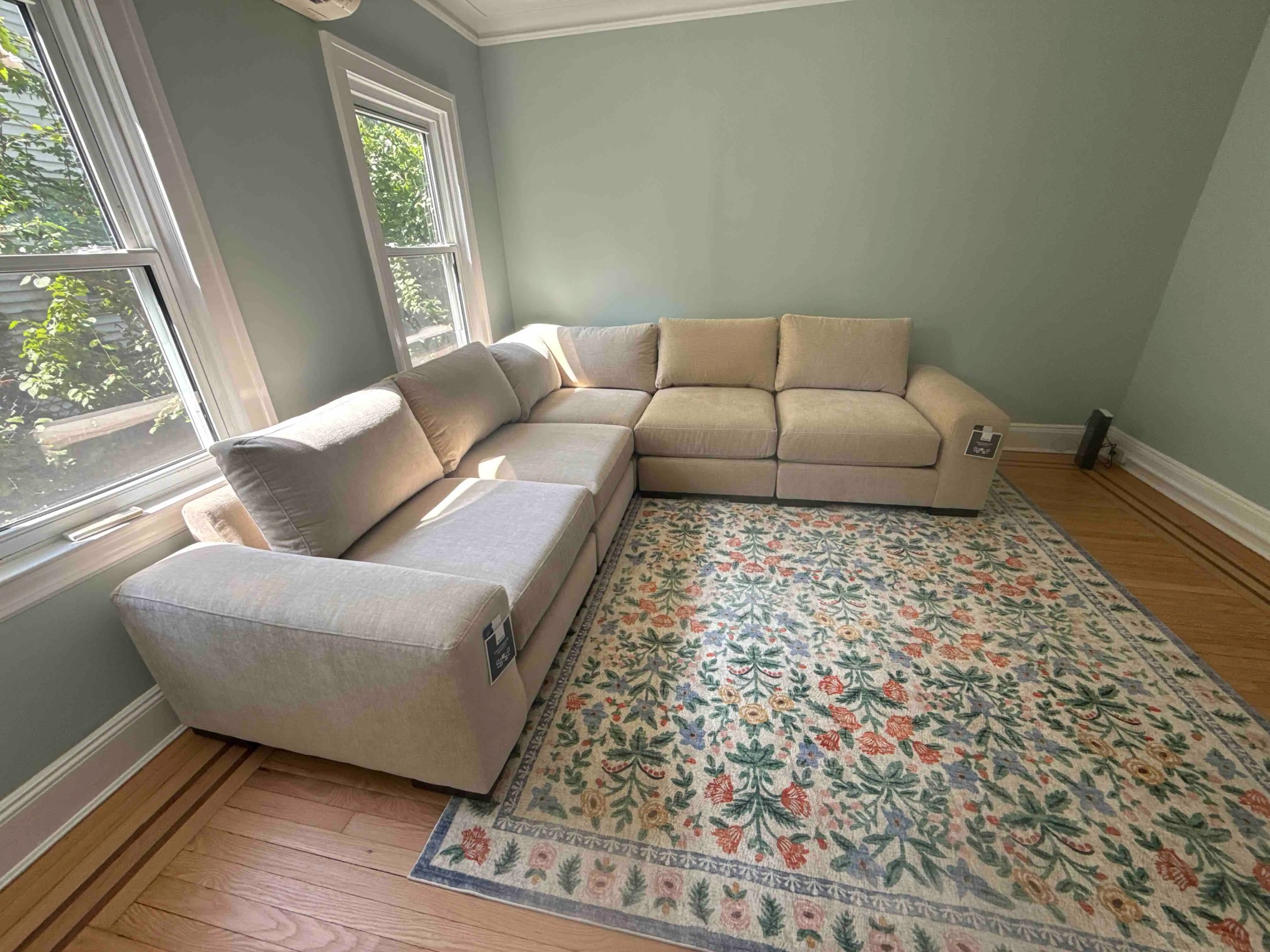 Sectional couch in the corner of a customer’s entertainment room set up by RF Delivery