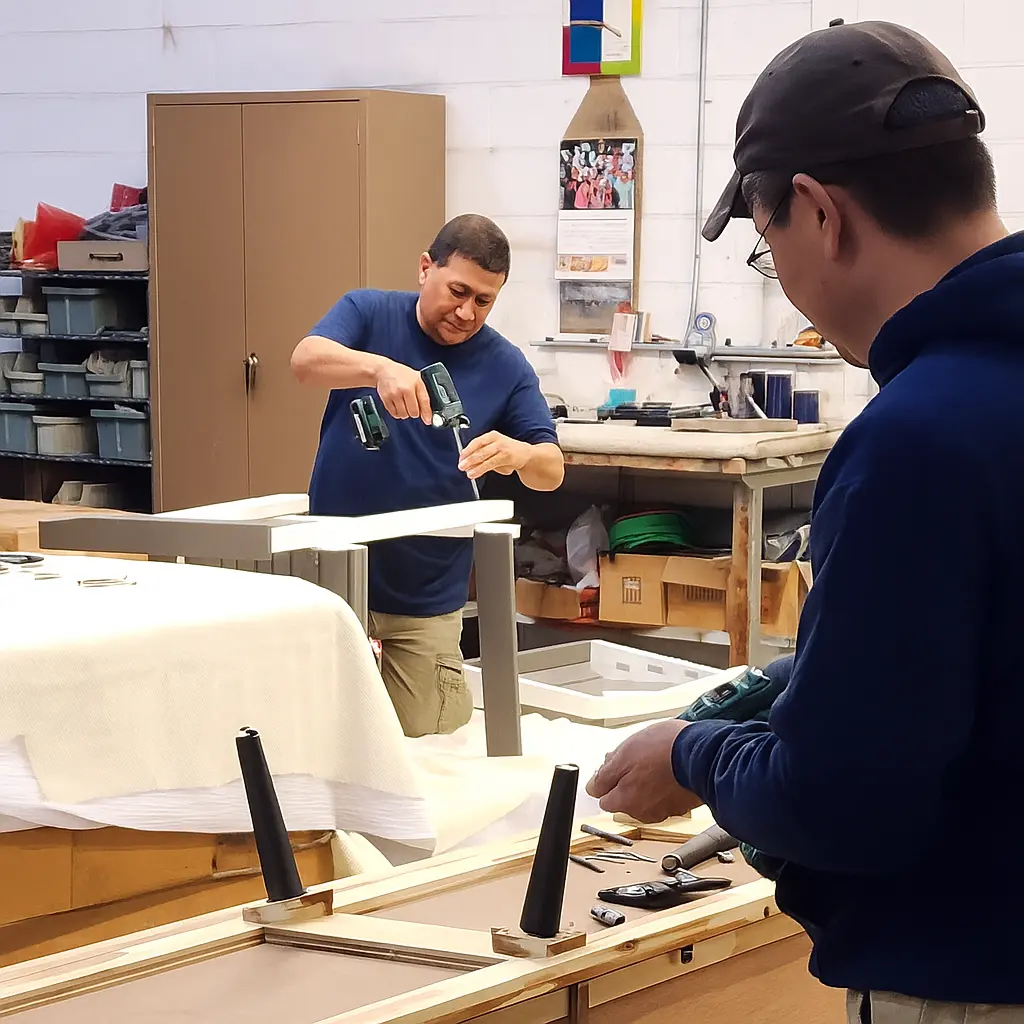 Two RF Delivery team members providing expert in-house furniture assembly and repair in Long Island, NY