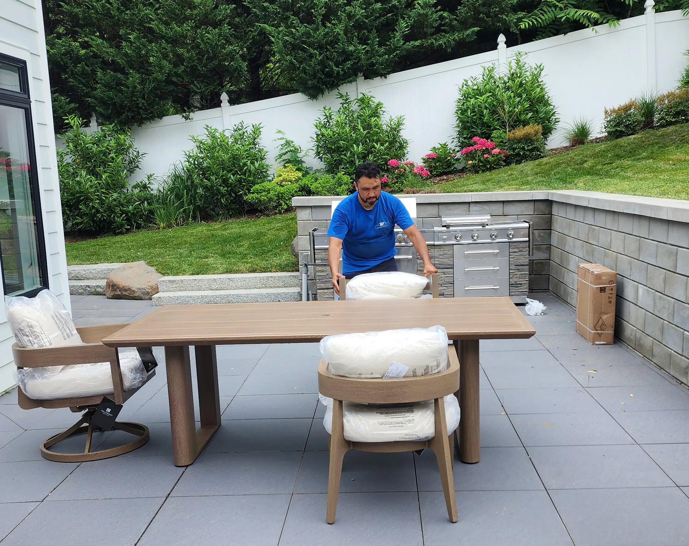 RF Delivery team carefully setting up customer furniture during white glove residential delivery in Long Island, NY